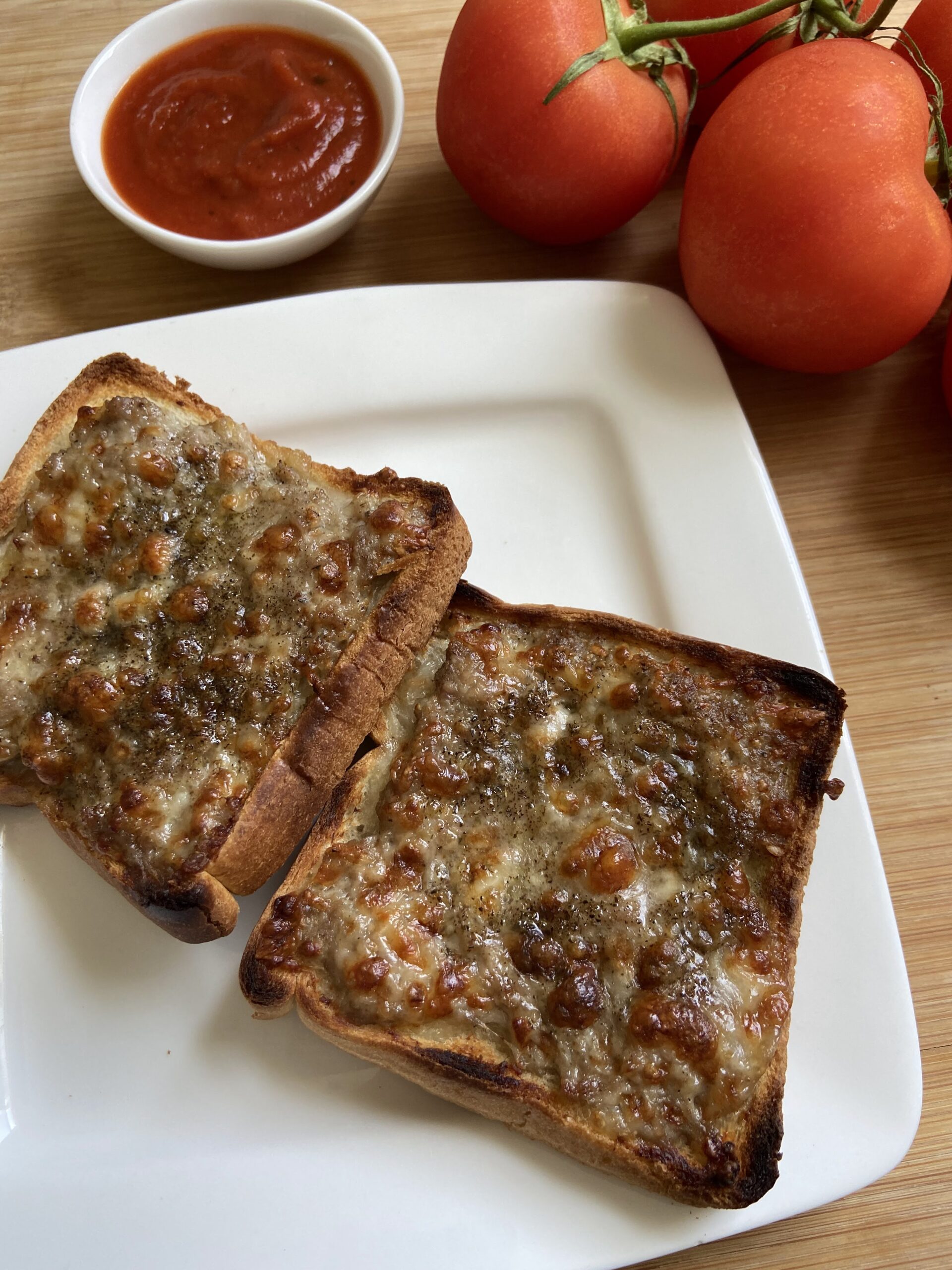 Ground meat and cheese open face sandwiches