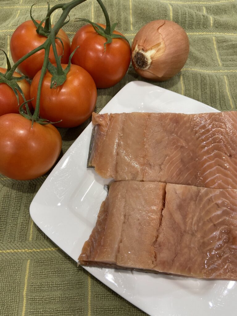 salmon fillets
tomato on the vine
onion