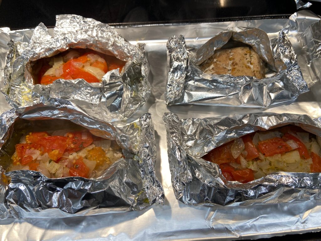 salmon, chopped onion, salt, pepper, and extra virgin olive oil in a foil packet baked in the oven