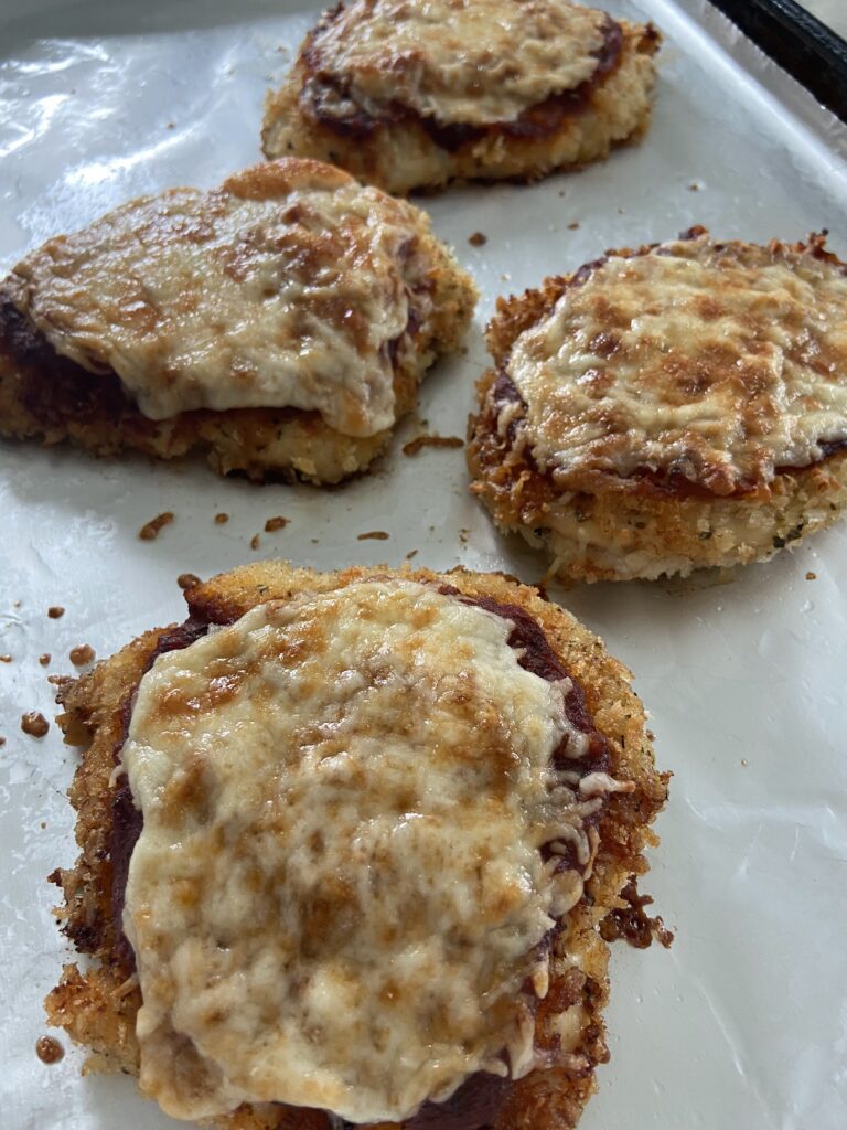 Chicken parmesan
Chicken cutlets coated with tomato sauce and cheese and baked until cheese is melted and golden brown
