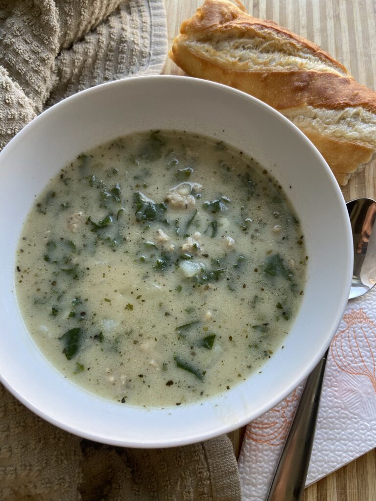 Chicken sausage, kale and potatoes soup
piece of French baguette
