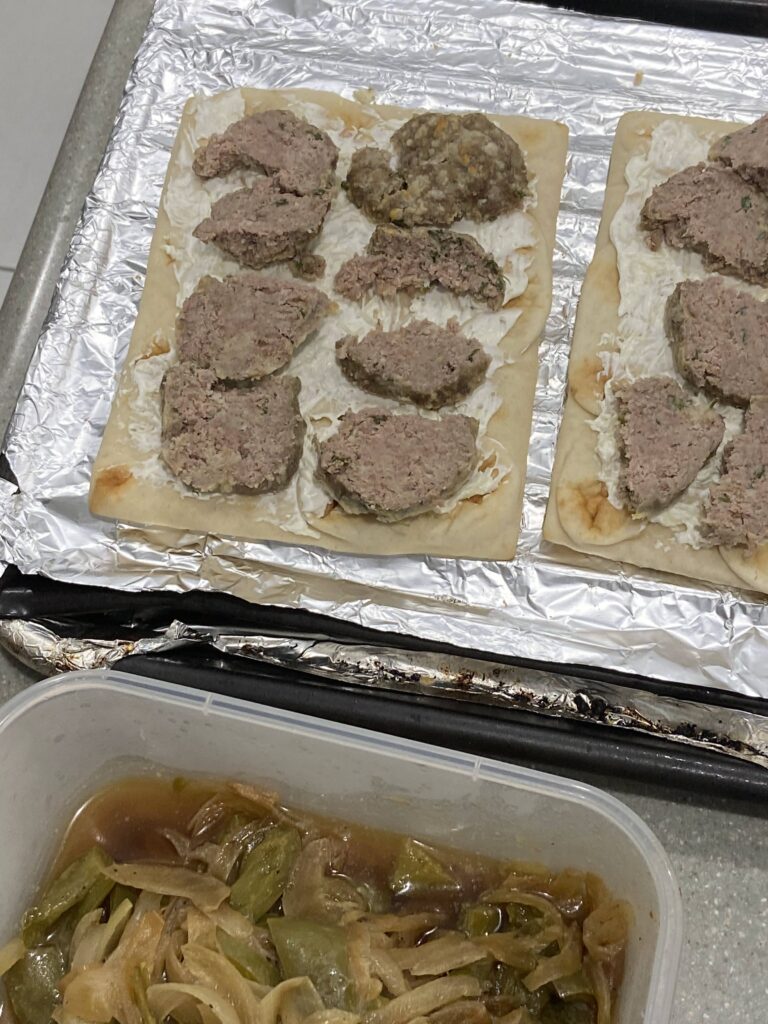Mini meatloaves cut into pieces
leftover sauteed peppers and onions