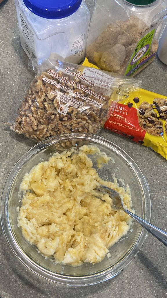 mashed bananas
bananas mashed with fork in a bowl 
