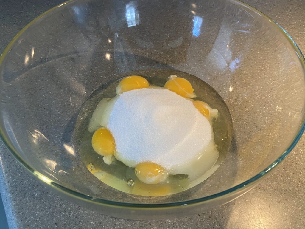 5 eggs cracked in a bowl
add a cup and half of sugar