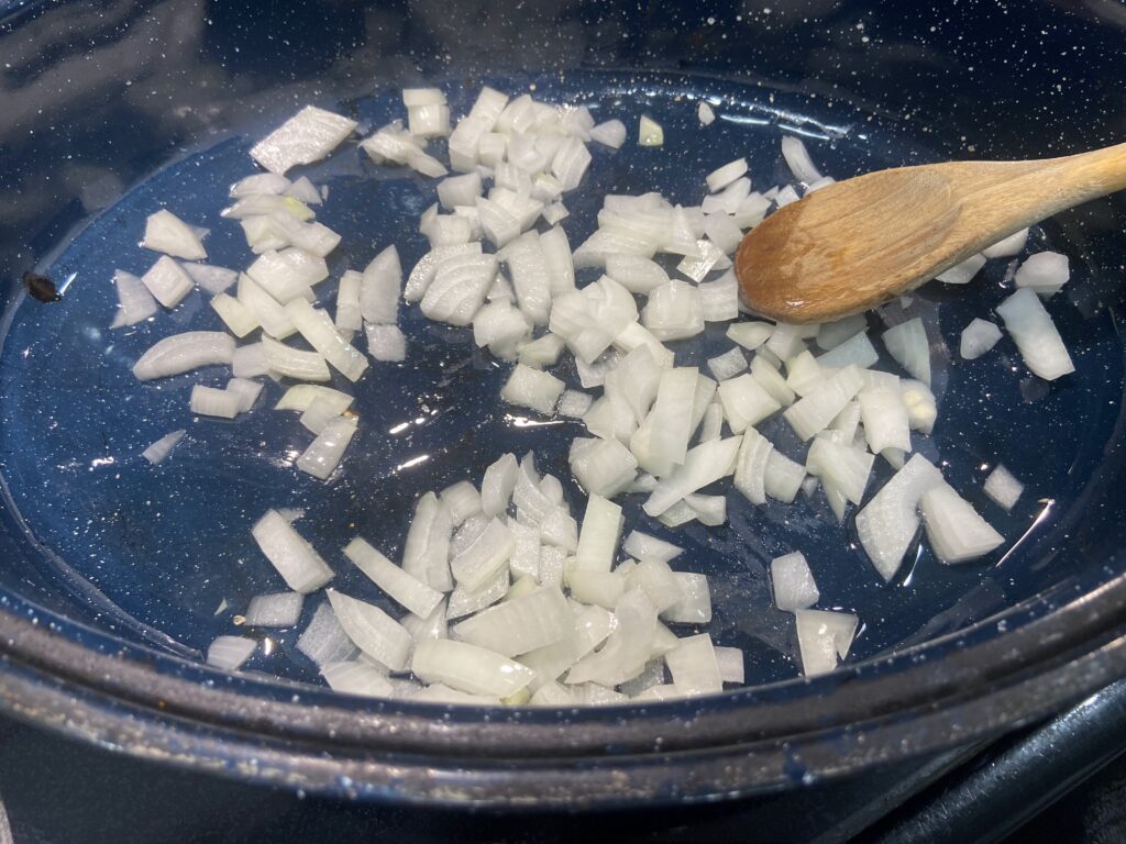 diced onion sauteed in a pan