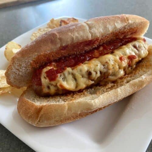 A cheese stuffed Italian sausage on a bun.