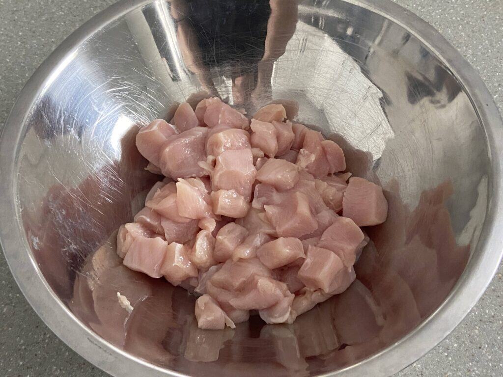 chicken breasts in baking dish for green bean casserole

mixing cream of chicken soup and green beans

baked chicken green bean casserole in pan