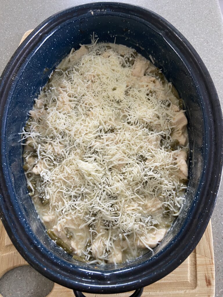 chicken breasts in baking dish for green bean casserole

mixing cream of chicken soup and green beans

baked chicken green bean casserole in pan