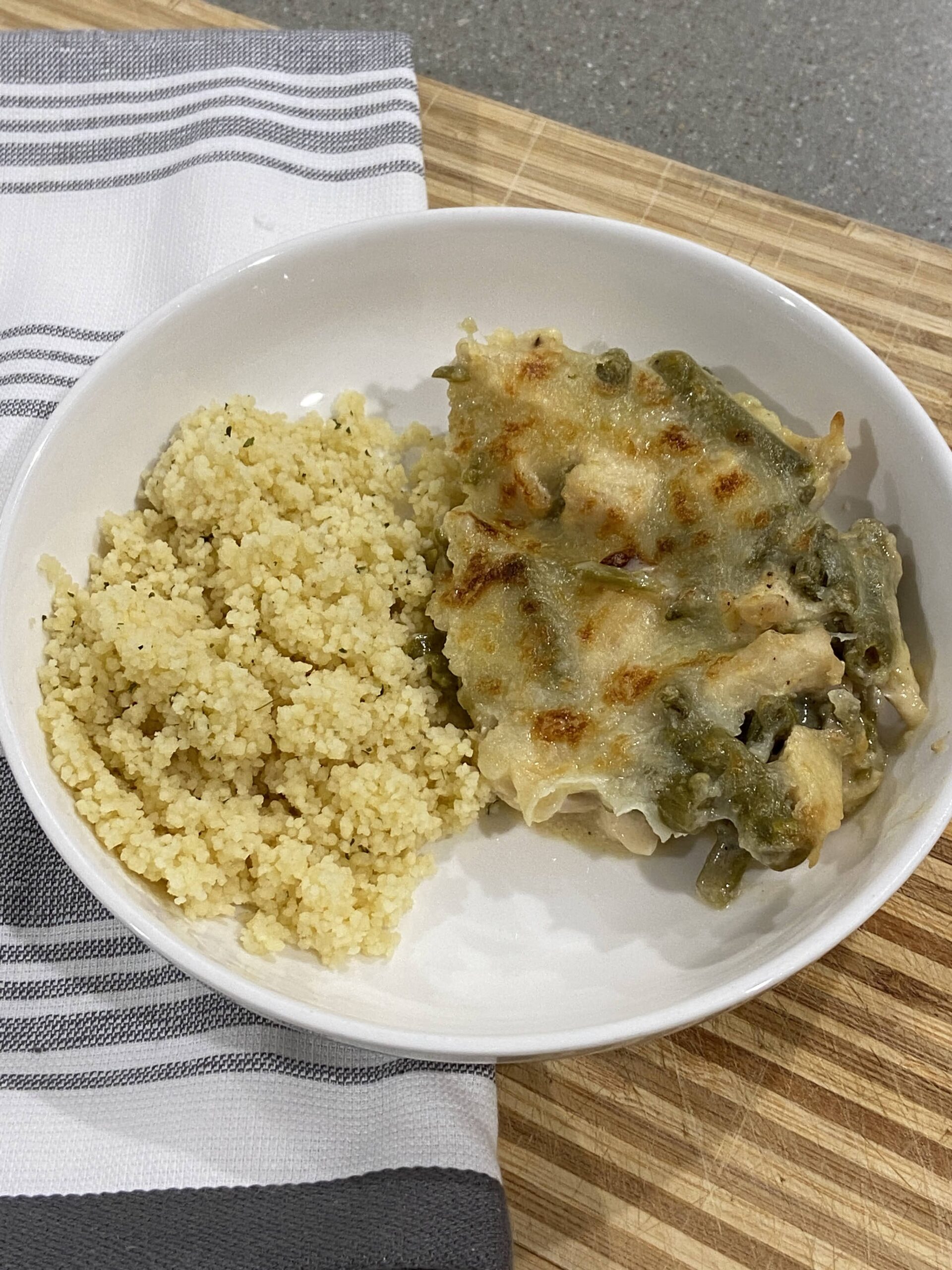 chicken breasts in baking dish for green bean casserole mixing cream of chicken soup and green beans baked chicken green bean casserole in pan